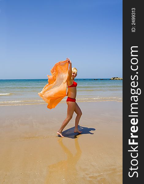 Girl runs on beach