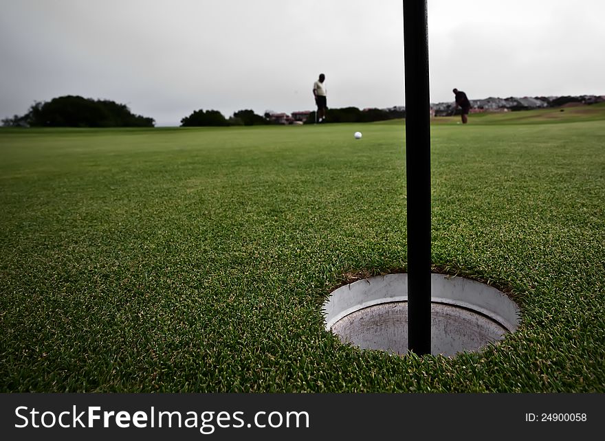 Golfing in a country club. Golfing in a country club.