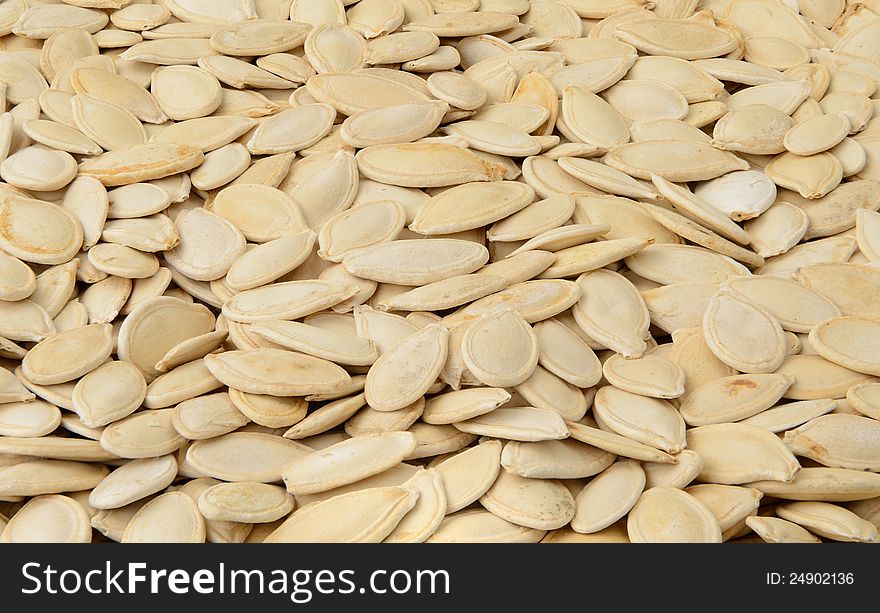 Close-up of pumpkin seeds, food background, isometric view