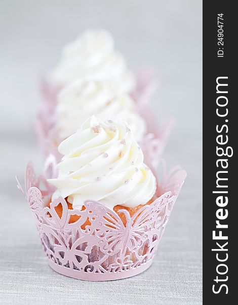 Cupcakes with vanilla cream, selective focus