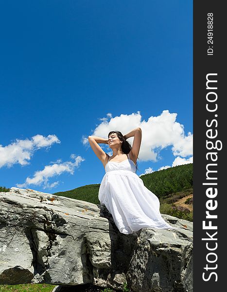 Woman feeling the air and heat in her face in nature. Woman feeling the air and heat in her face in nature.