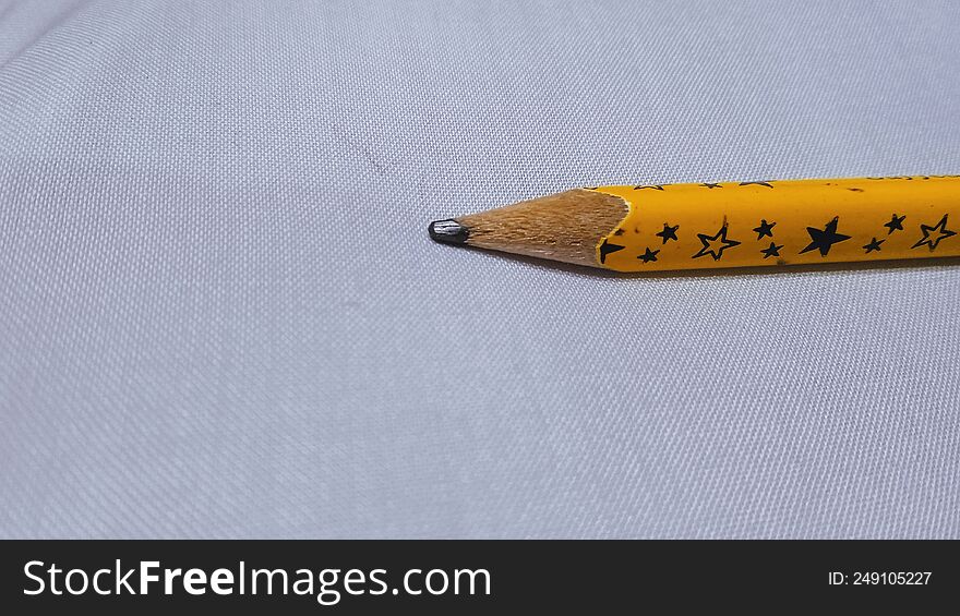 mustard color led pencil with white background