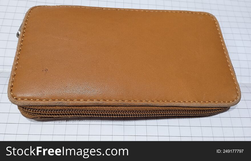 Brown wallet on white background