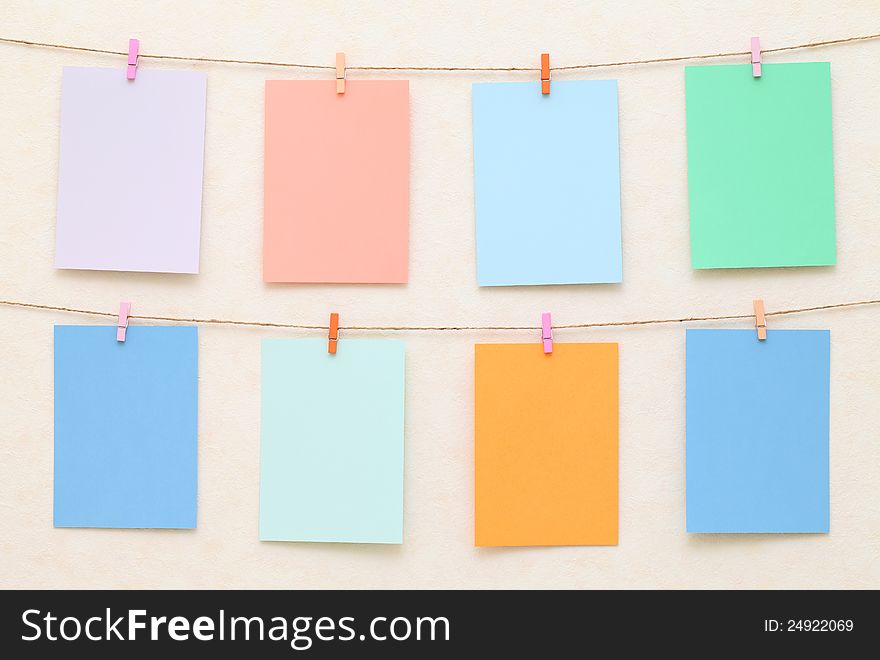 Hanging colorful Sheet of Paper with clothespins. Hanging colorful Sheet of Paper with clothespins