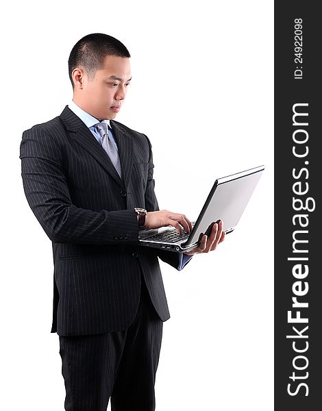 Young asian businessman holding laptop