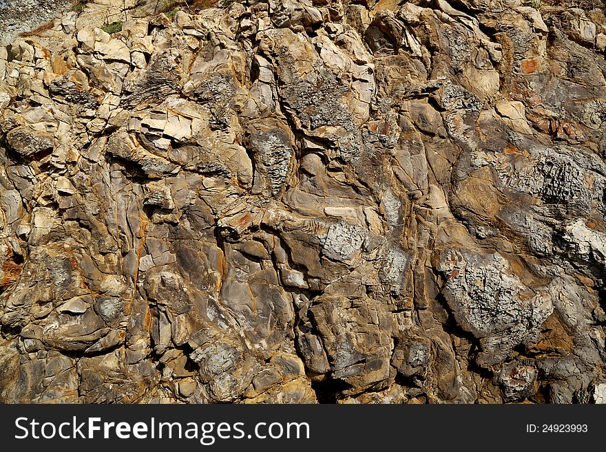 Background with a textured stone granite rocks and minerals. Background with a textured stone granite rocks and minerals