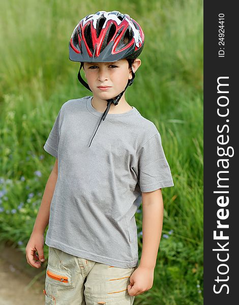 Portrait of boy bicyclist with helmet