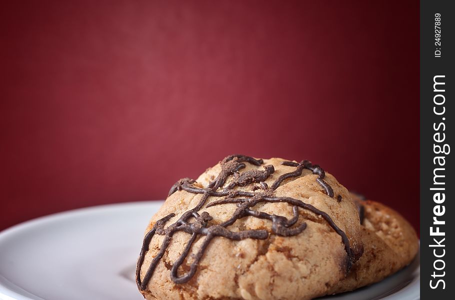 Close up of Chunky Chocolate Chip Cookie over red background