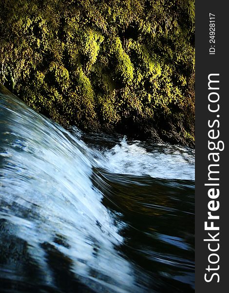 Small waterfall covered with moss