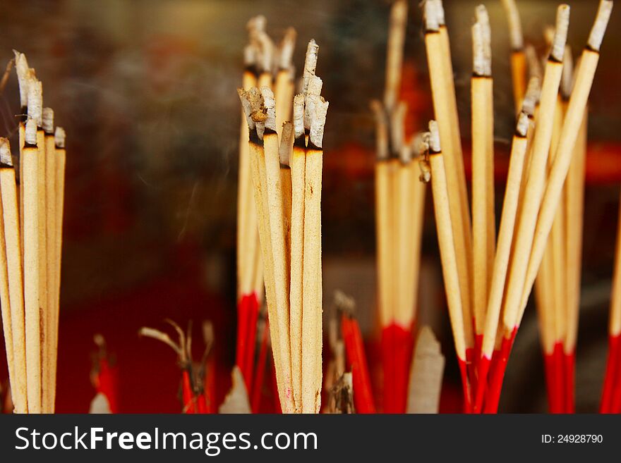 Burning incense sticks filled with smoke. Burning incense sticks filled with smoke.