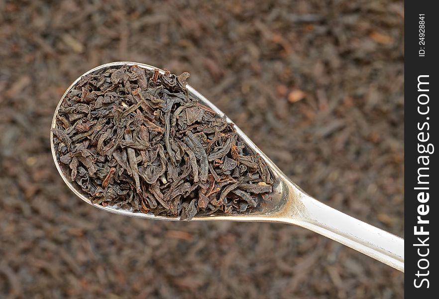 Close-up of dry tea on teaspoon