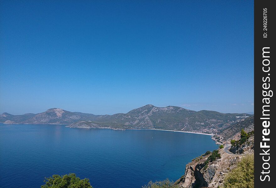 Road in the mountains overlooking the sea.