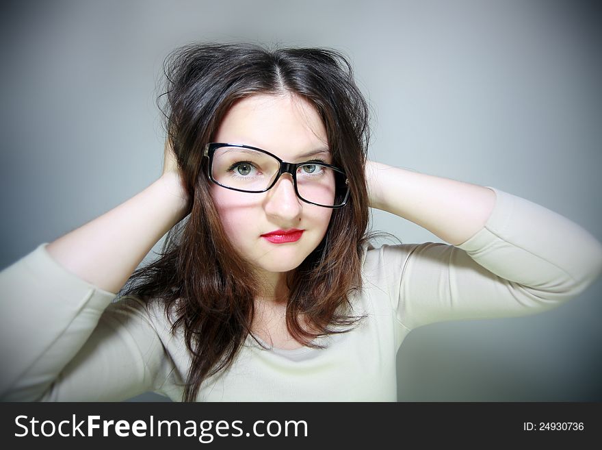 Glamor girl in glasses in dark background. Glamor girl in glasses in dark background