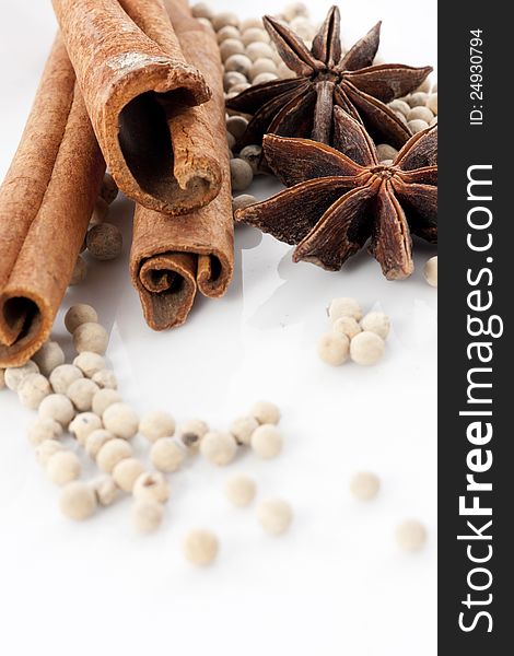 Star Anise, Cinnamon and White Pepper on White Background. Star Anise, Cinnamon and White Pepper on White Background
