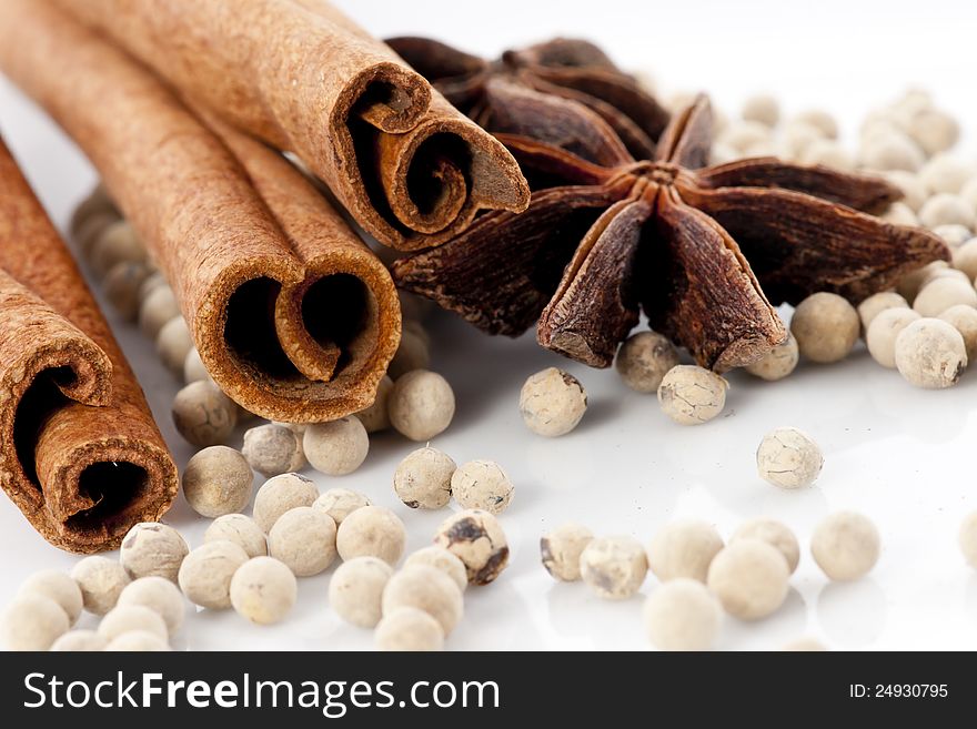 Star Anise, Cinnamon and White Pepper on White Background. Star Anise, Cinnamon and White Pepper on White Background