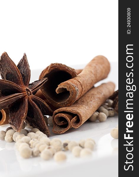 Star Anise, Cinnamon and White Pepper on White Background. Star Anise, Cinnamon and White Pepper on White Background