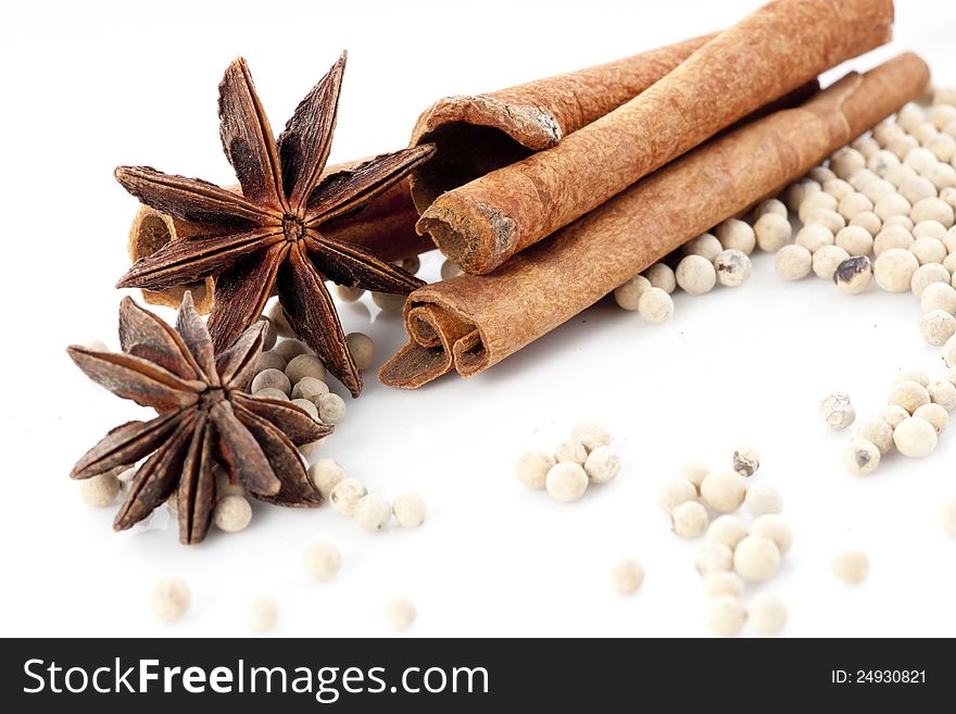Star Anise, Cinnamon and White Pepper on White Background. Star Anise, Cinnamon and White Pepper on White Background