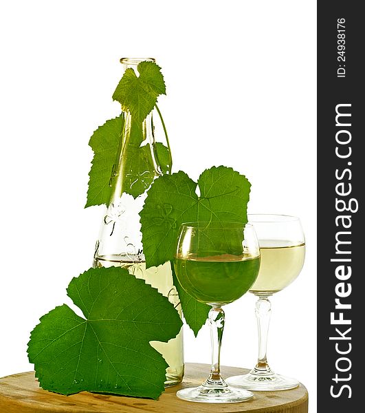 A Bottle Of White Wine And Two Wineglasses