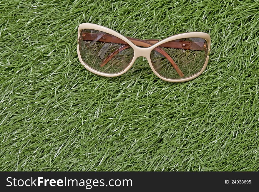 Glasses on green grass on the outdoor