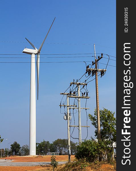 Wind energy turbine power station and power lines transporting electricity. Wind energy turbine power station and power lines transporting electricity.