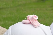 Baby Shoes On A Pregnant Womans Belly Royalty Free Stock Photos Baby Shoes On A Pregnant Womans Belly Royalty Free Stock Photos