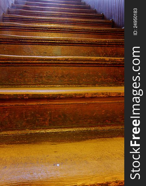 Old, well-worn wooden steps ascending. Old, well-worn wooden steps ascending