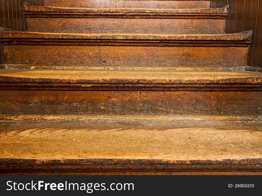 Old, well-worn wooden steps ascending. Old, well-worn wooden steps ascending