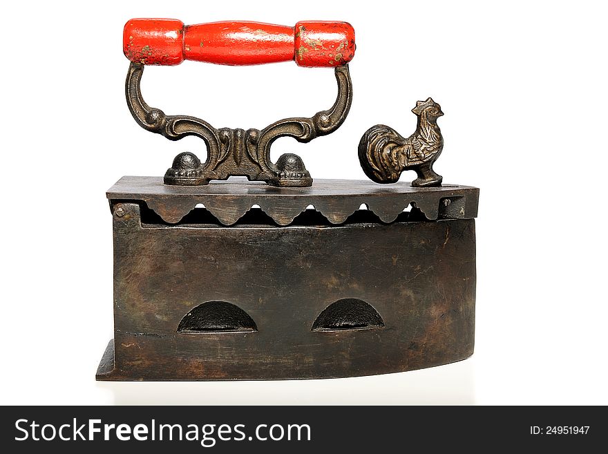 Old Vintage iron with red handle isolated on a white background