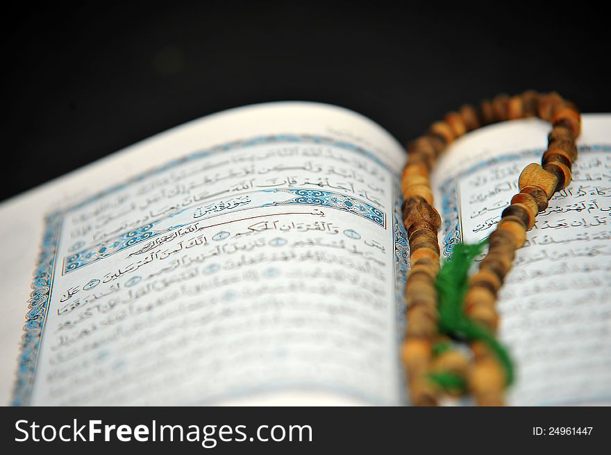 Opend holy book quran and rosary. Opend holy book quran and rosary