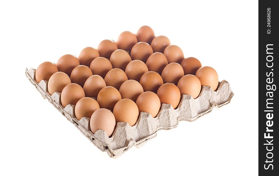 Carton of fresh brown eggs on white background