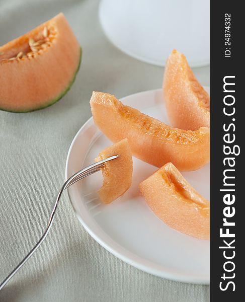 Dish with slices of melon