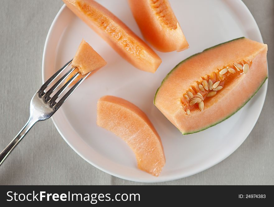 Dish with slices of melon