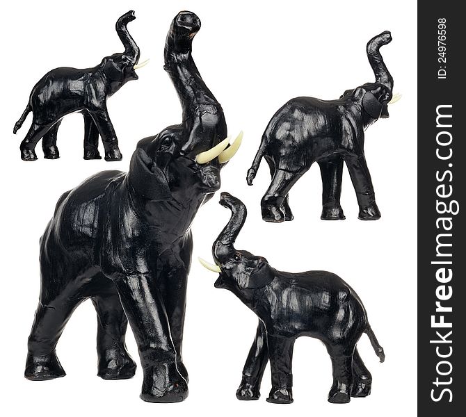 A set of black leather elephant figurines isolated on a white background