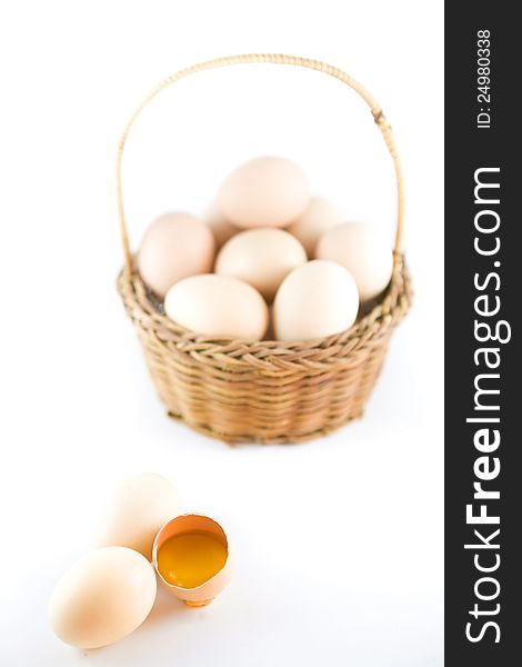 Eggs and yellow yolk on white background