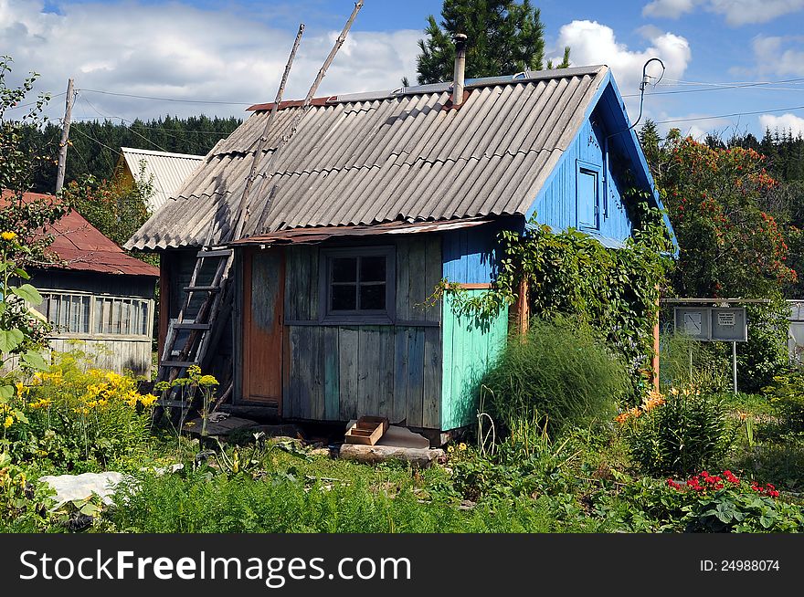 The old cottage on the allotment, in the middle of the forest in the mountains