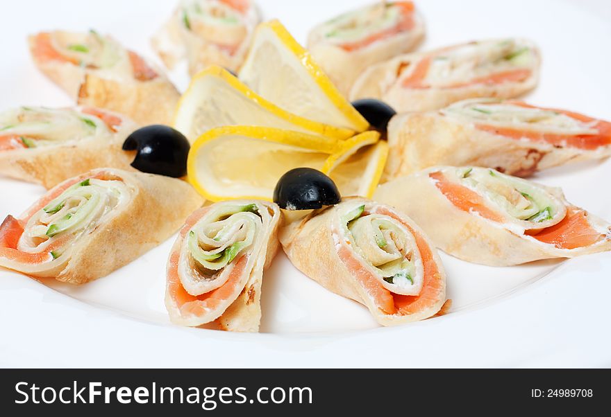 Pancakes With Salmon On A White Plate