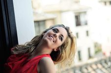 Blonde Woman In A Window Wearing A Red Dress Stock Photos Blonde Woman In A Window Wearing A Red Dress Stock Photos