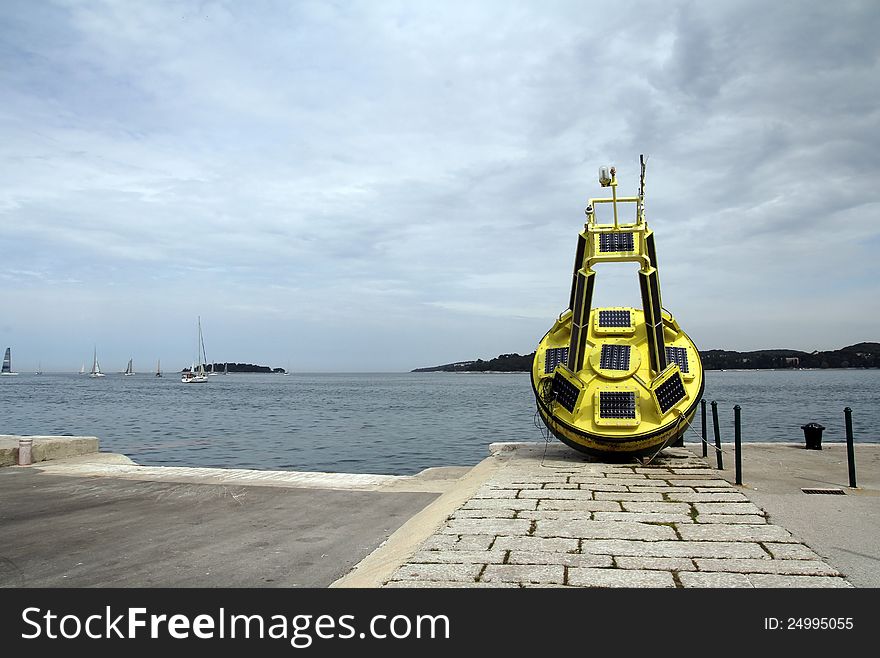 A navigation buoy in country in a harbour in Croatia
