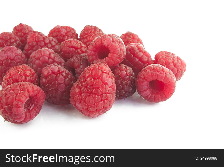 Raspberries close up on white background