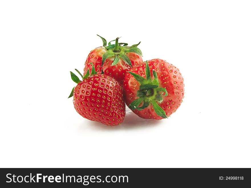 Three strawberries on white background