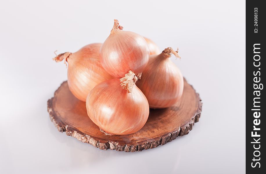 Pile of onions isolated on grey