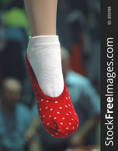 Manequin leg with 2 socks on display