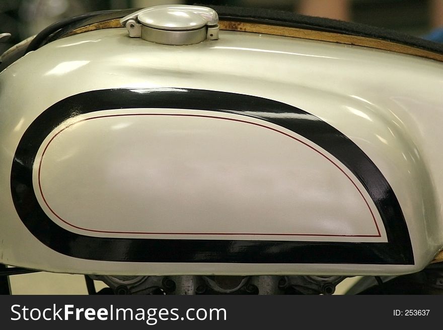 Cropped section of old motorcycle tank. Cropped section of old motorcycle tank.