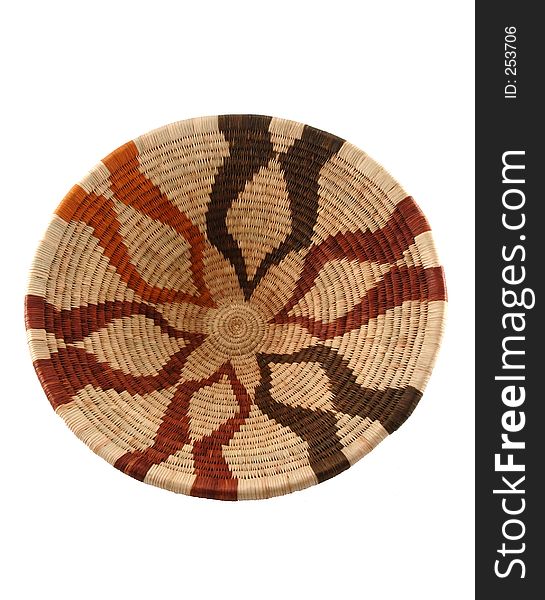 Woven open basket from Botswana. Made from the fiber of the Mokola palm tree. The natural cream-coloured fiber is dyed shades of brown with roots or bark of the Motlhakola and Motsentsila trees.