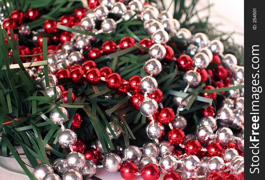 Red and silver beaded garland and Christmas greens