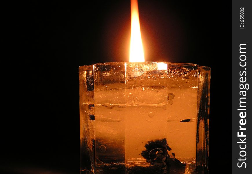 Liquid candle burning in the dark