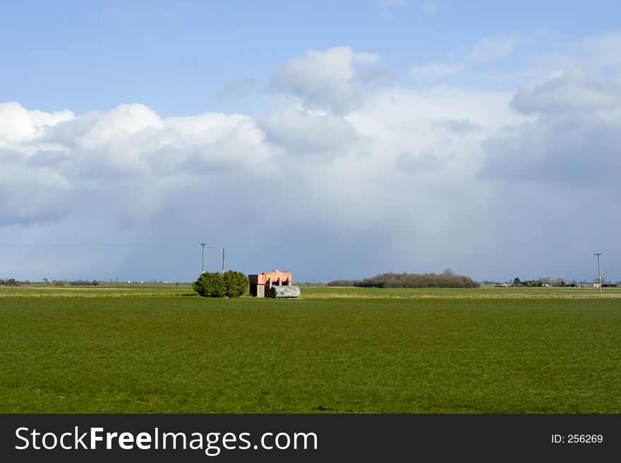 Landscape shot of a little house in the countryside. Landscape shot of a little house in the countryside