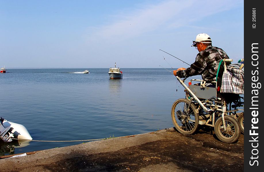 The Fisherman On A Coast