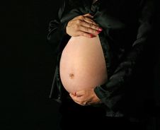 Pregnant Woman Holding Her Stock Photo