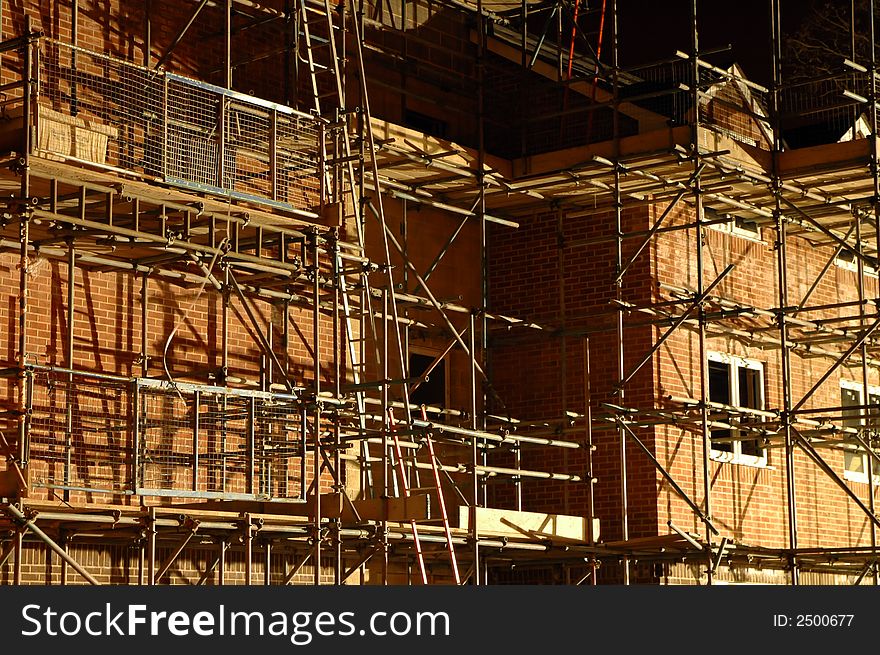 Complex construction site scaffolding at night. Complex construction site scaffolding at night